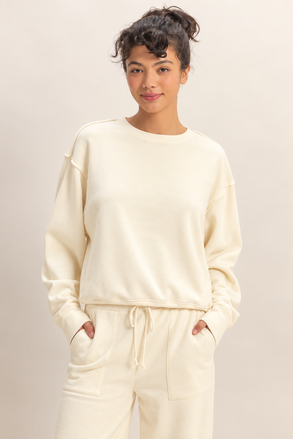 Double Zero raw edge detail sweatshirt in Whip Cream styled with matching pants.