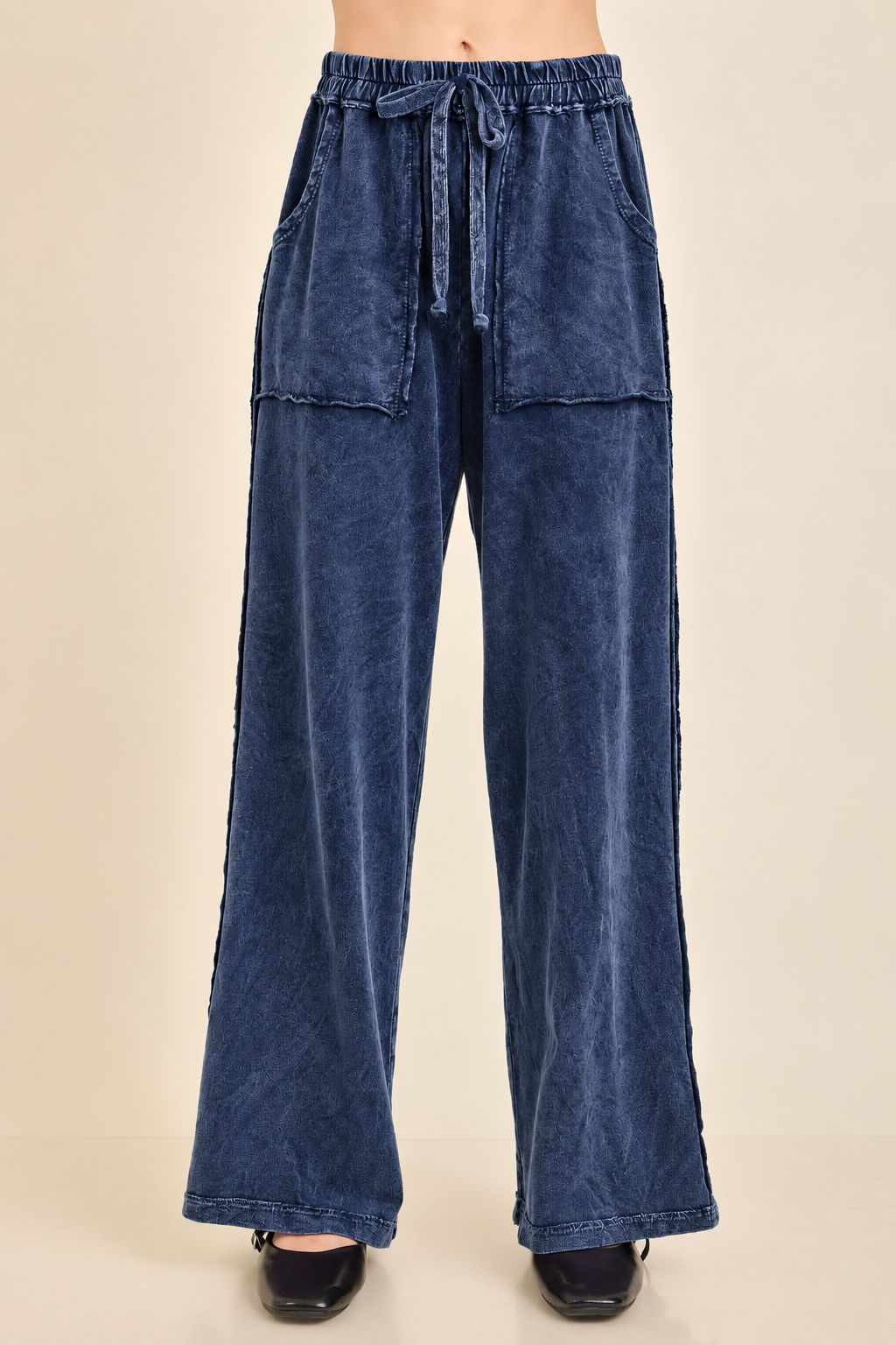 Navy J.Her mineral wash wide-leg pants with elastic waist, front pockets, exposed seam details, and side slit.