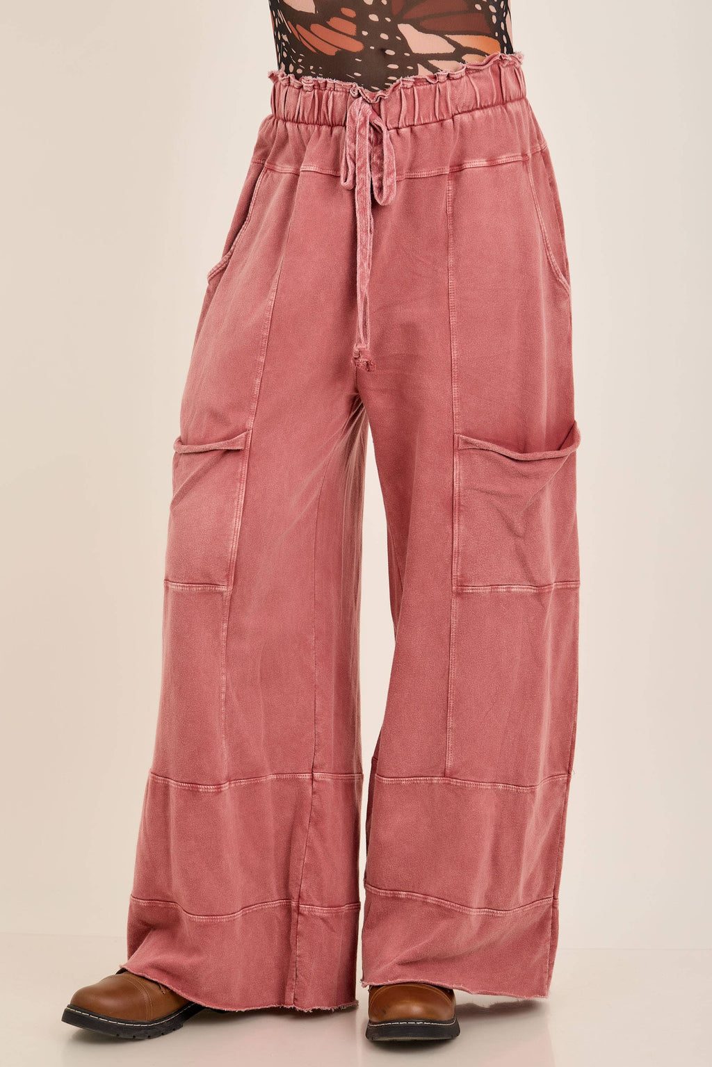 Terracotta J.Her mineral wash wide-leg pants with drawstring waist, front pockets, panel seams, and raw-edge hem.