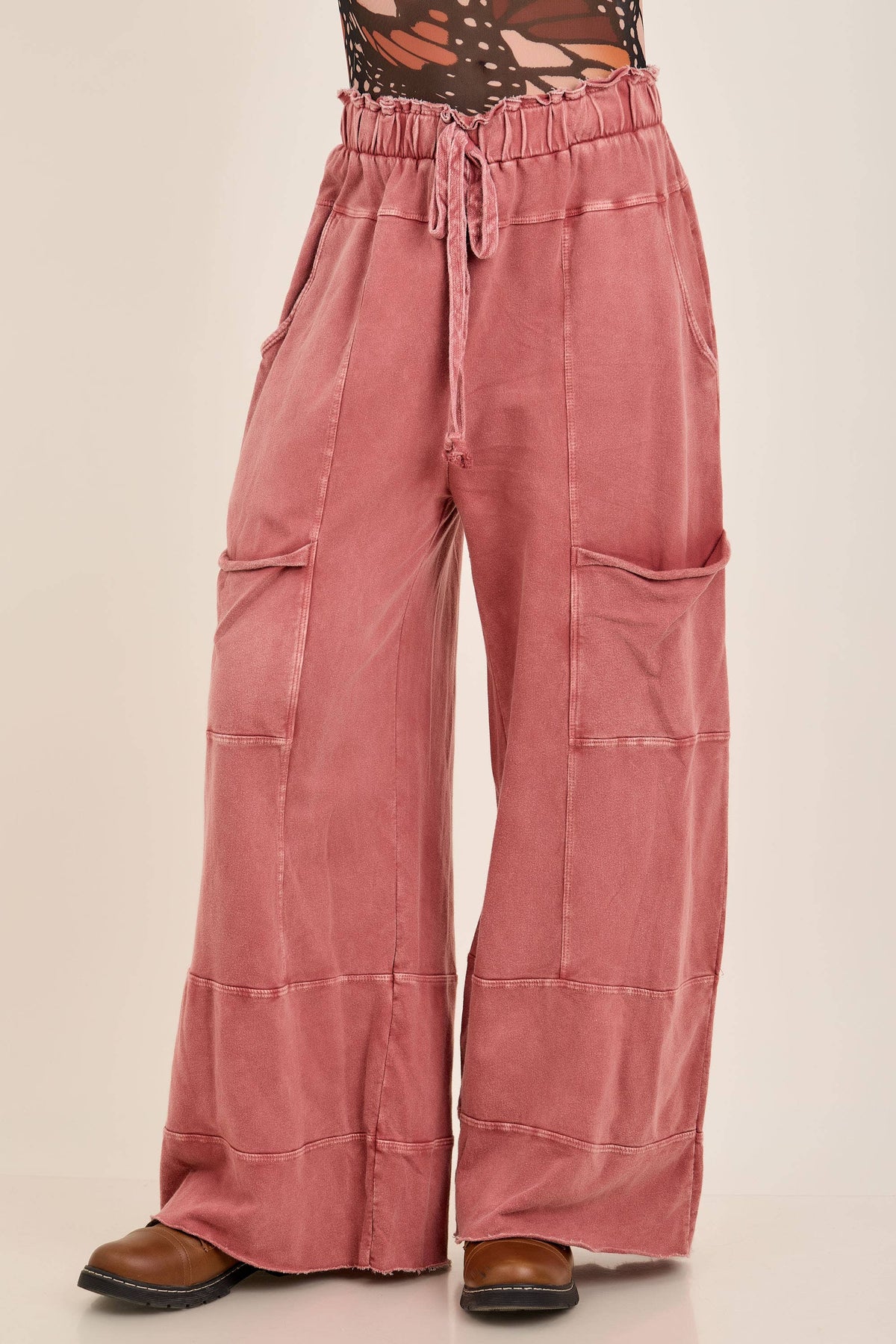 Terracotta J.Her mineral wash wide-leg pants with drawstring waist, front pockets, panel seams, and raw-edge hem.