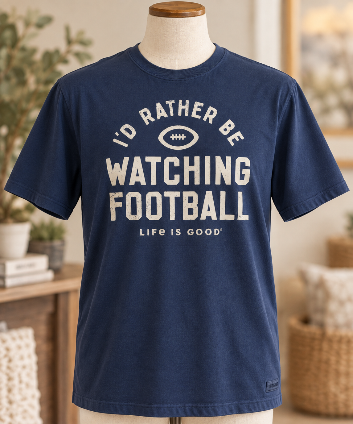 Life is Good men’s I’d Rather Be Watching Football tee in Darkest Blue displayed on a torso mannequin.