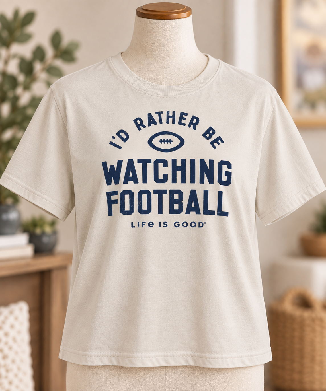 Life is Good women’s I’d Rather Be Watching Football tee in Putty White displayed on a torso mannequin.