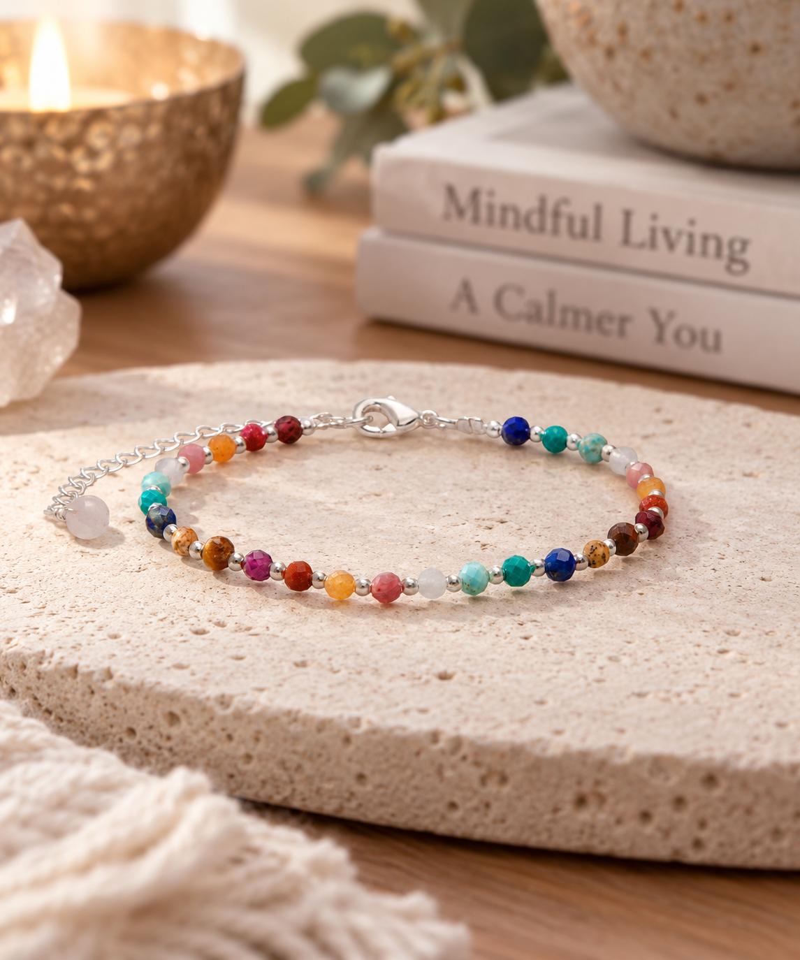 Lotus and Luna Master Healer women’s bracelet with colorful gemstone beads and silver accents on a neutral lifestyle background.