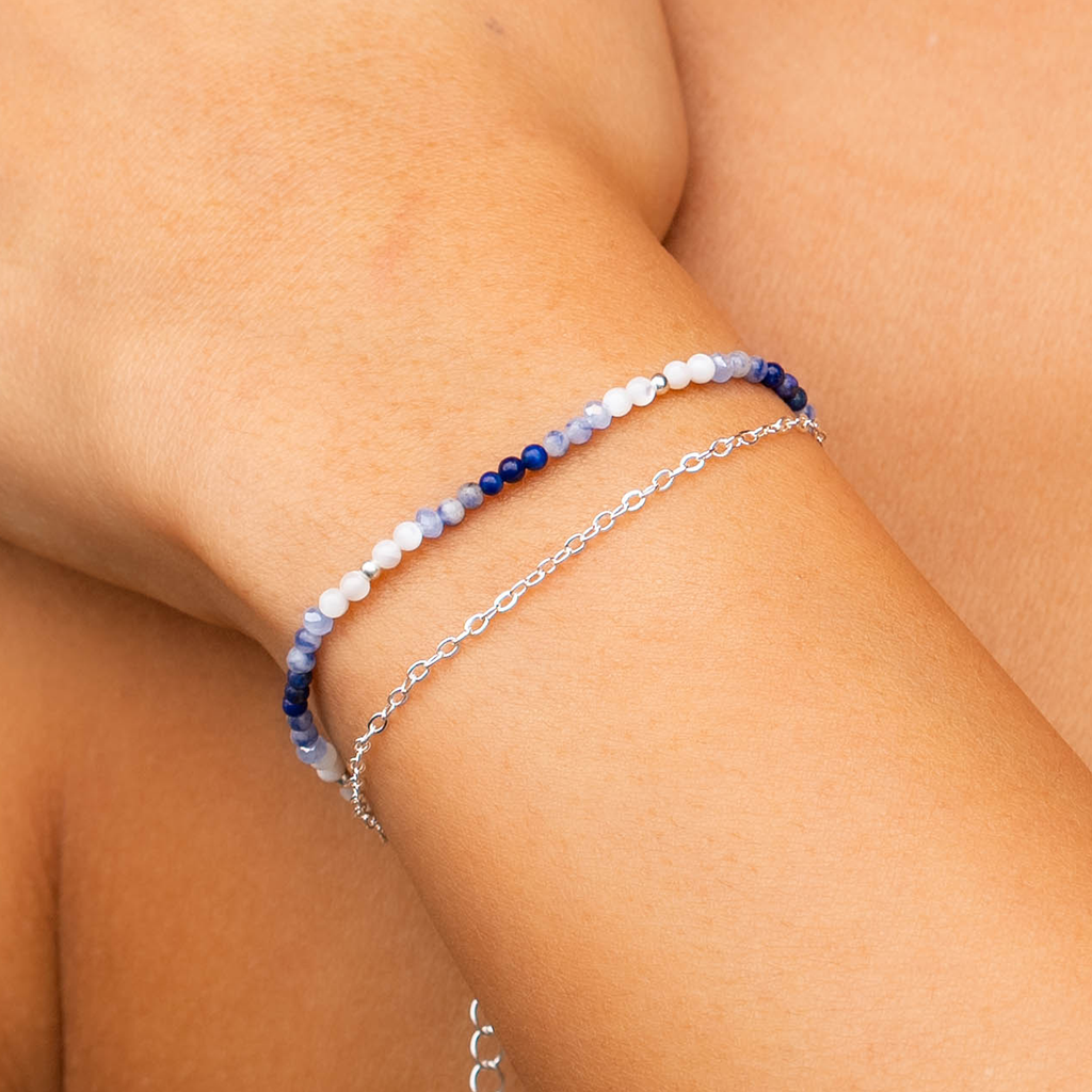 Lotus and Luna women’s bracelet with moonstone and lapis beads and silver-tone chain detail.