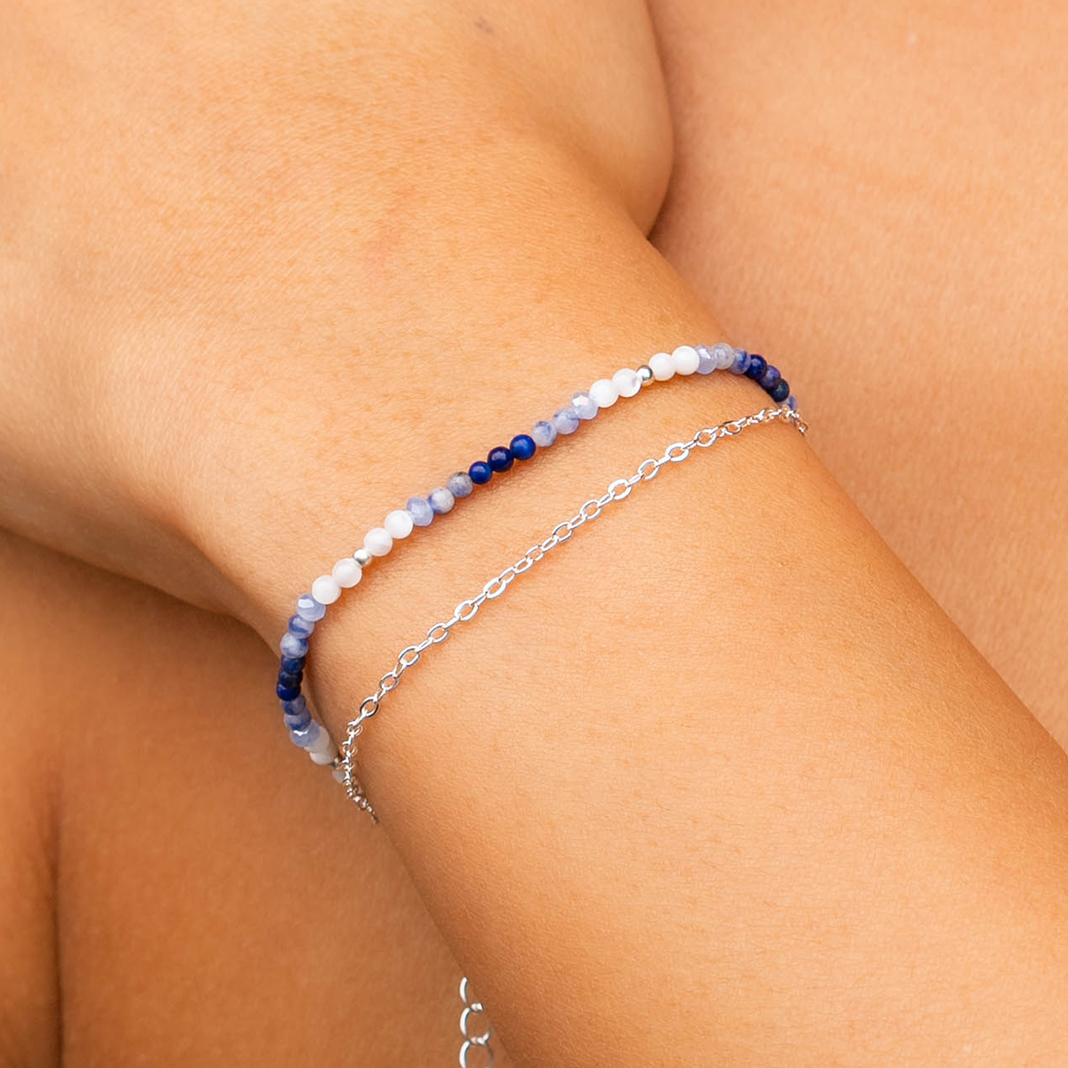 Lotus and Luna women’s bracelet with moonstone and lapis beads and silver-tone chain detail.