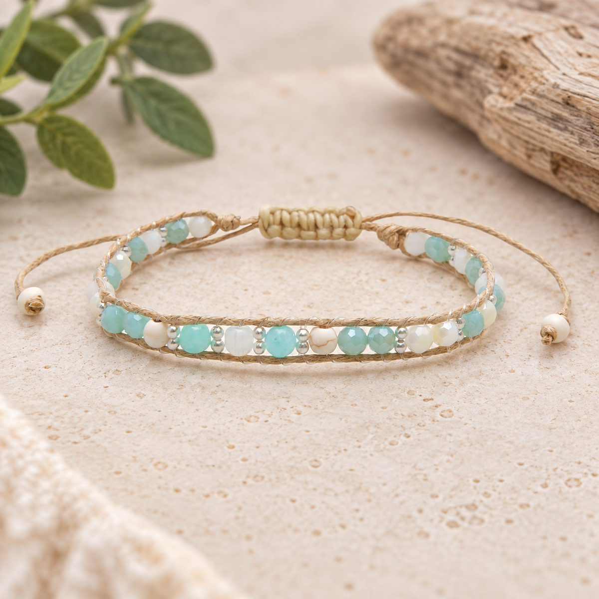 Lotus and Luna Over the Moon Moonbeam women’s bracelet with aqua and white beads on a neutral lifestyle background.