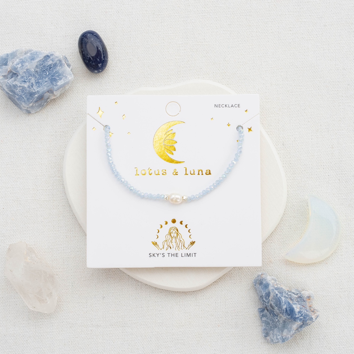 Lotus and Luna Sky’s The Limit Goddess necklace with blue beading and a single natural Pearl.