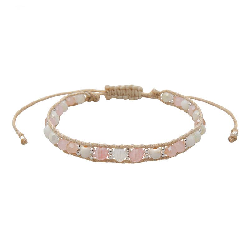 Lotus and Luna Winter Blush bracelet with soft pink and white semi-precious stones on an adjustable cotton cord